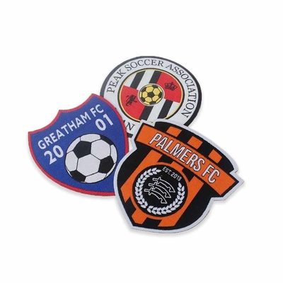 Ijzer op de Flarden van de Klitbandkleding voor Voetbal Team Applique worden geweven dat