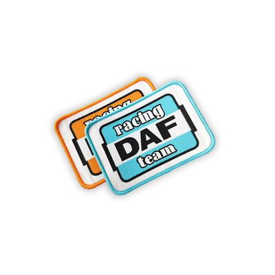 Stokijzer op Geweven het Garenmateriaal van Flardetiket Geborduurd Merrowed